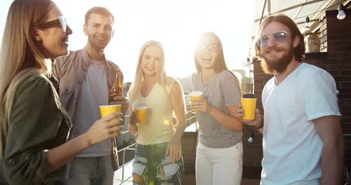 Five Friends Laughing and Celebrating Outdoors