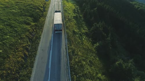 Aerial View of Truck Driving on Rural Road