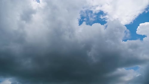 Dramatic Clouds Moving in a Blue Sky