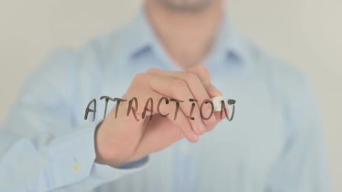 Man Writes Attraction on Glass Screen