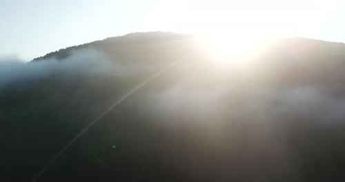 Aerial View of Mountains with Fog at Sunrise
