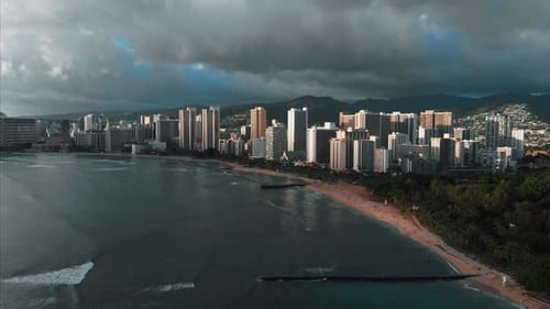Aerial drone footage of Honolulu, Hawaii.
Beautiful real estate, buildings in the city.
Palm trees