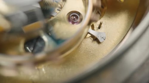 Moving Gold Gears Inside Working Pocket Watch Mechanism