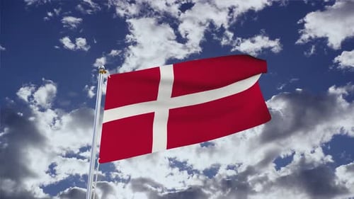 Danish Flag Waving Against Cloudy Sky