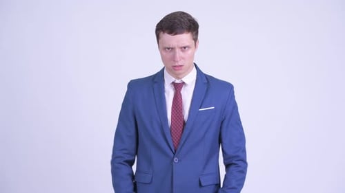 Furious Man in Suit Yelling and Shaking Fists