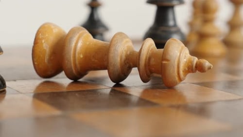 Shallow DOF wooden chess set figures end of game 4K 2160p 30fps UltraHD footage - White player king