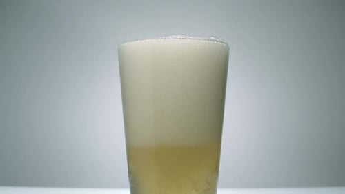 Cold Beer Pouring into a Glass