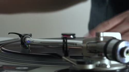 Hands Using Turntable Close Up