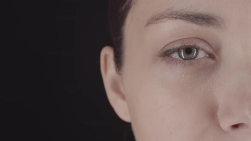 Extreme Close Up of Eye on Black Background