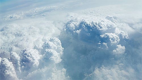 Aerial View of Fluffy White Clouds and Blue Sky