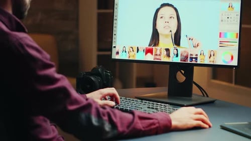 Talented Photographer in Home Office at Night