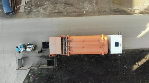 Loading garbage truck in Krasnodar.