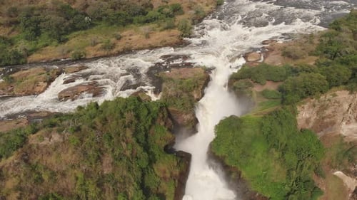 Aerial drone shot of the path of a river and its final waterfall.
Africa, Murchinson Falls National