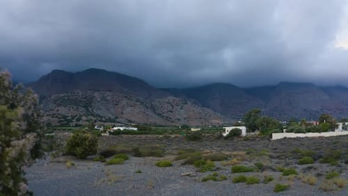Aerial view of Greek Landscape. Clouds over Mountain. Drone Flying near trees. Stormy cloudscape