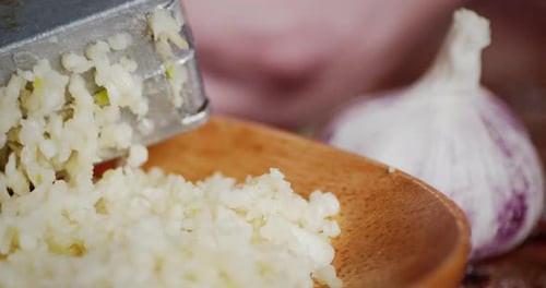 Fresh Garlic Crushed in the Masher at the Plate.