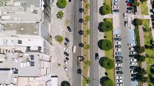 Aerial View of Busy Street of Resort Town with Parking Lots and Passing Cars