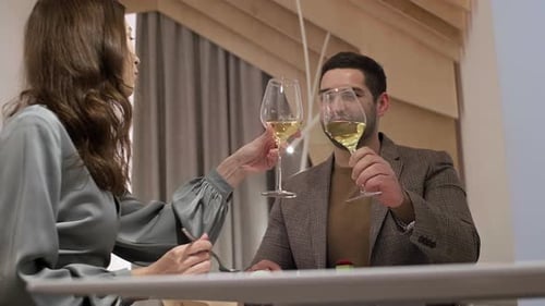 Caucasian Man and Woman Dining in Restaurant