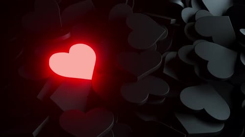 Pulsating Glowing Red Heart Among Dark Hearts Background
