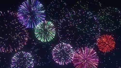 Vibrant Fireworks Exploding Against Dark Night Sky for Celebration Background