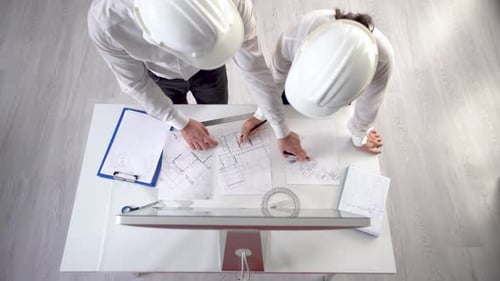 Engineers in white helmets.