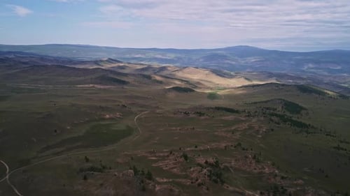 Baikal Valley spirits,Tazheran Steppe, Stone Cliffs on the Road. Aerial Summer