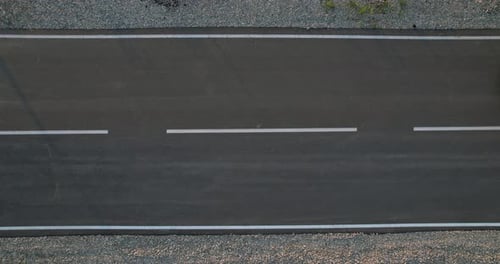 Aerial View of Cars Driving Down Road