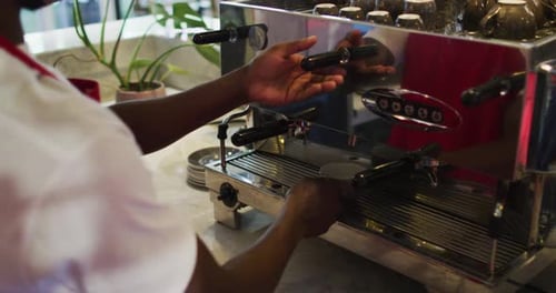 Barista Making Espresso in a Cafe, Close Up