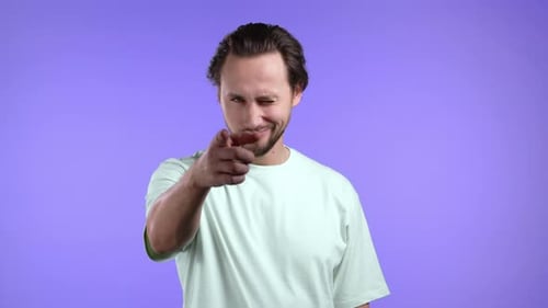 Man Points Finger Directly at Camera