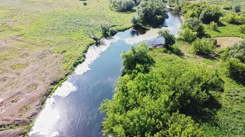 Aerial View of Beautiful Summer Scenery. Sun Is Reflected in the River Surface