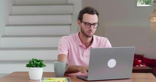 Handsome Successful Young Caucasian Man Wearing a Light Pink Polo Shirt Freelance Worker Experienced