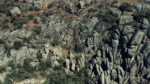 Aerial View of a Cliff Side Enveloped in Rocks Resembling a Stone Wall