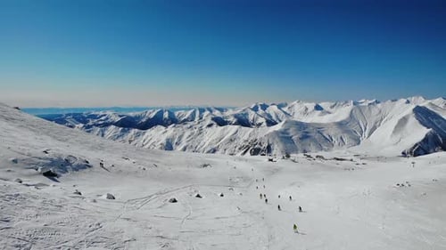 Tourists Enjoying Sport in Winter Ski Resort