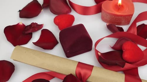 Romantic Proposal with Rose Petals, Candle, and Ring