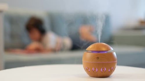 Aroma Diffuser Emits Scented Vapor in Brightly Lit Room
