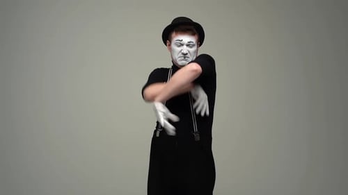 Portrait of Offended Unhappy Male Mime Folding Hands on Chest and Looking Disgruntled at Camera