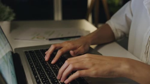 Adult Typing on Laptop at Night, Rubbing Eyes