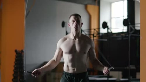 Athletic Man Trains and Jumps Rope Coordination Training Crossfit Training Day in the Gym Slow