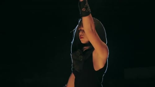 Woman Performing Fire Dance at Night