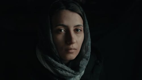 Intense Close-Up of Young Woman Wearing a Hood