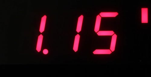 Futuristic Countdown Timer Displaying Red Numbers Close Up