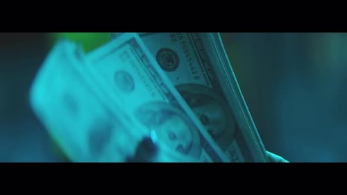 Hand Counting Stack of Cash Money