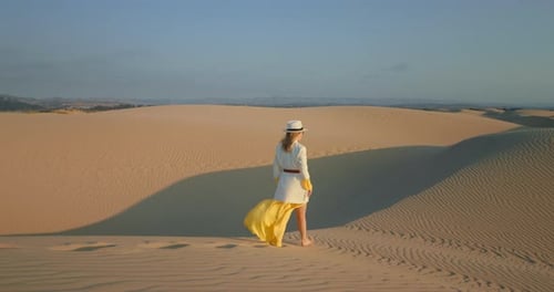 Girl Walking Barefoot in Desert Alone