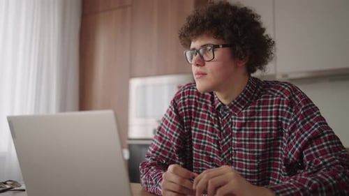 Young Adult Working at Home