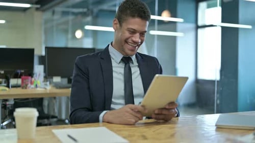 Young Adult Man on Video Call in Office