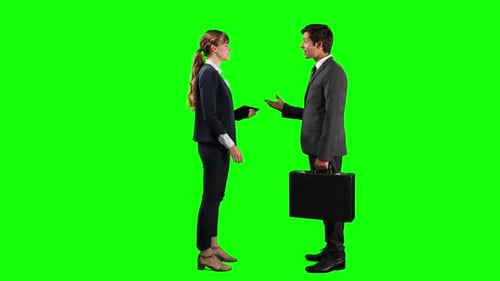Side view of business people making a deal and shaking their hands with green screen