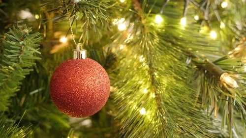 Festive Red Ornament on a Christmas Tree