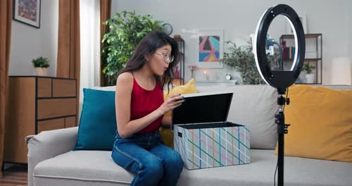 Woman Opening Box for Social Media Video