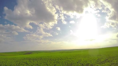 Sun and Clouds over Fields