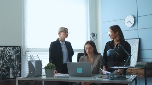 Three Businesswomen Working Together in Modern Office