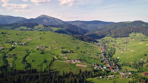 Mountain Village Under Cloudy Sky